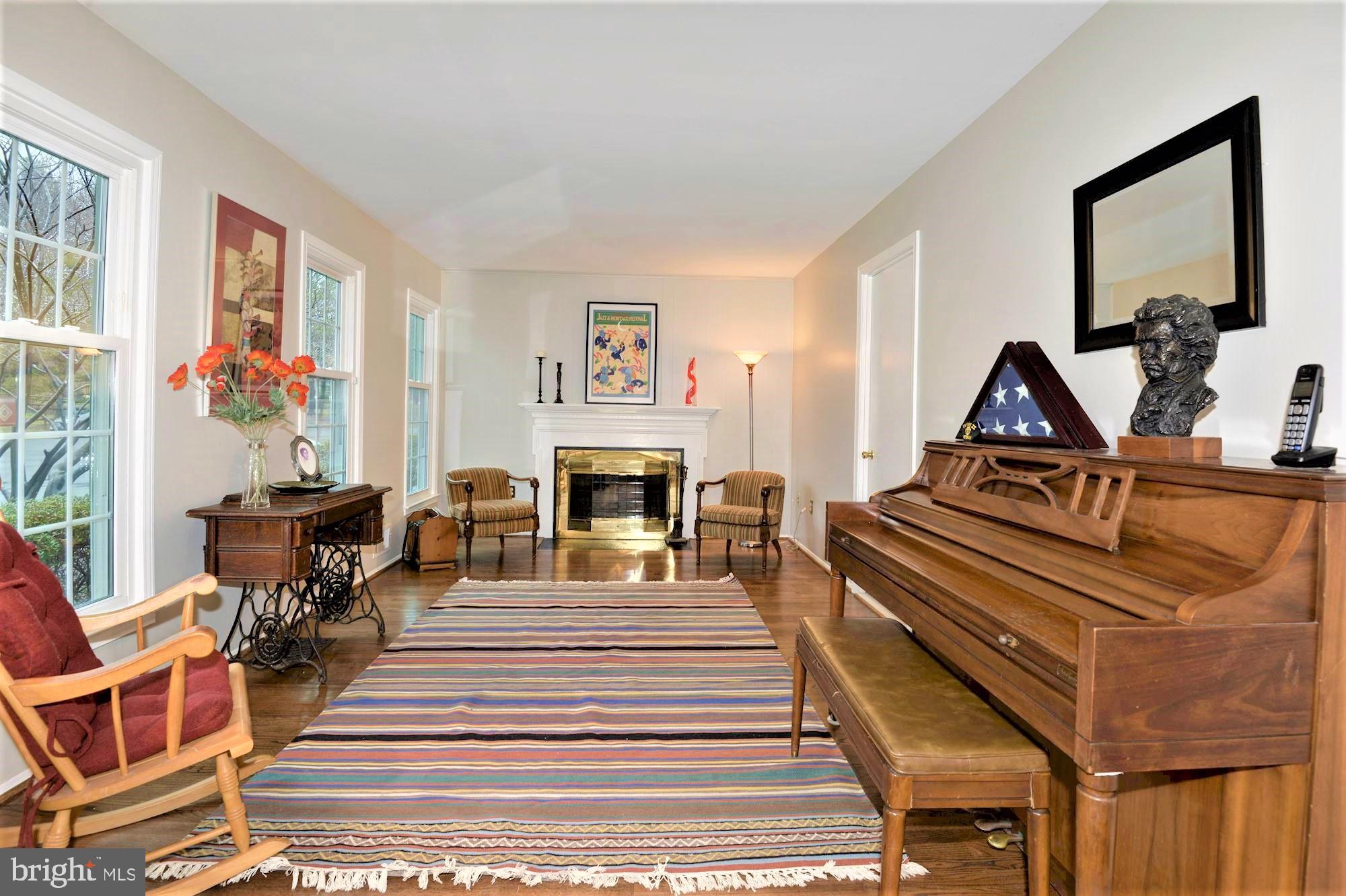 2305 Rosedown Drive Reston, VA 20191 - Photo 10 of 43 family room with a wood burning fireplace
