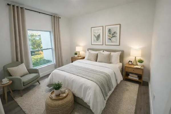 a bedroom with bed and a couch