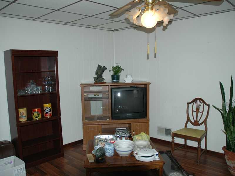 19 Maple Street Ellsworth, PA 15360 - Photo 2 of 5 Living Room. Nice hardwood floors in the living room.