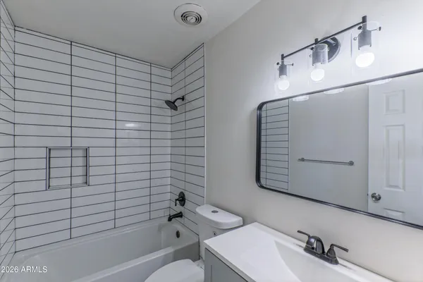 an aerial view of a house with parking space