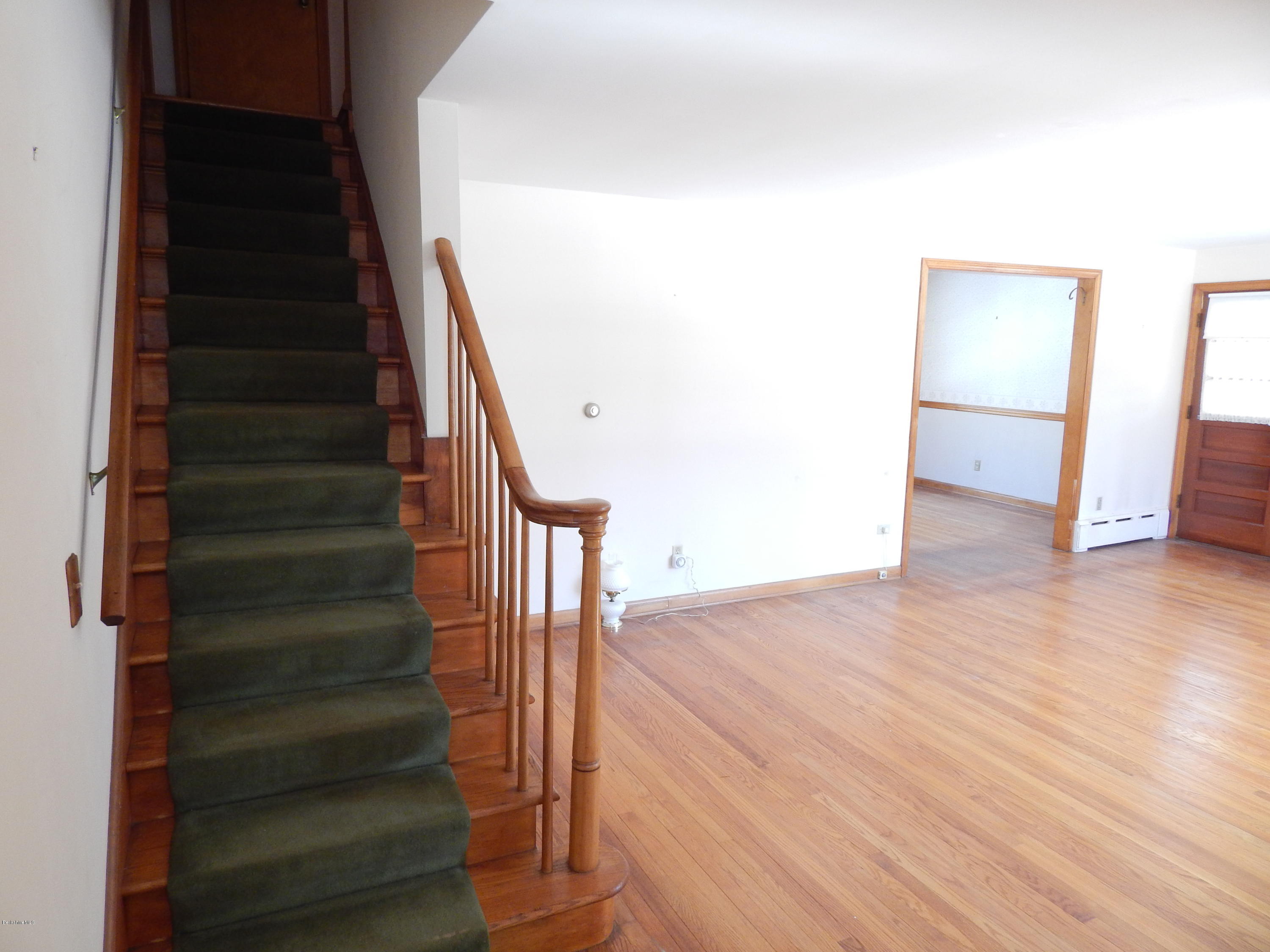 103 Northumberland Road Pittsfield, MA 01201 - Photo 3 of 13 Staircase through to Living Room