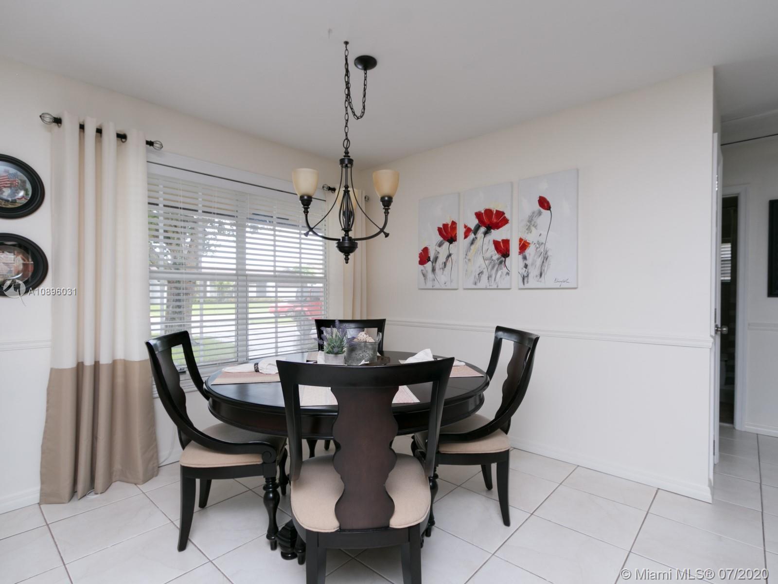 9518 Burlington Place Boca Raton, FL 33434 - Photo 11 of 35 a view of a dining room with furniture window and outside view