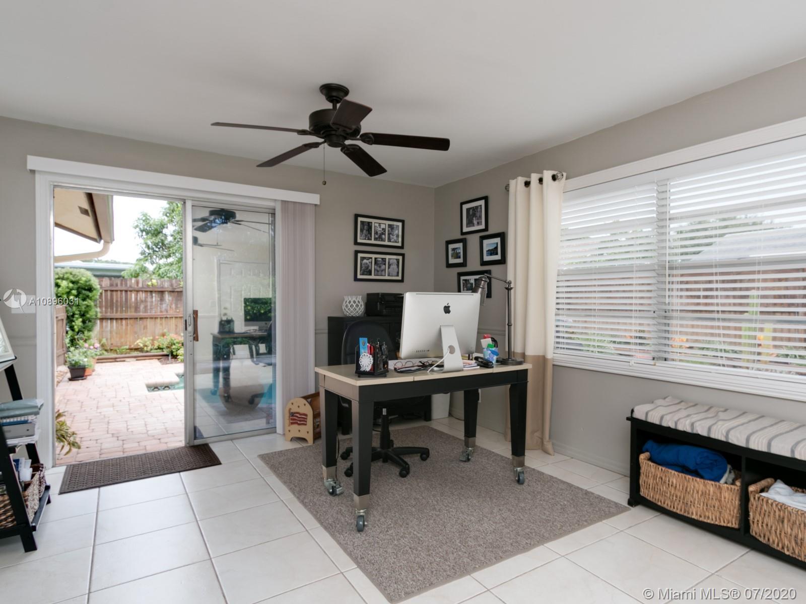 9518 Burlington Place Boca Raton, FL 33434 - Photo 20 of 35 a view of a workspace with furniture and a window