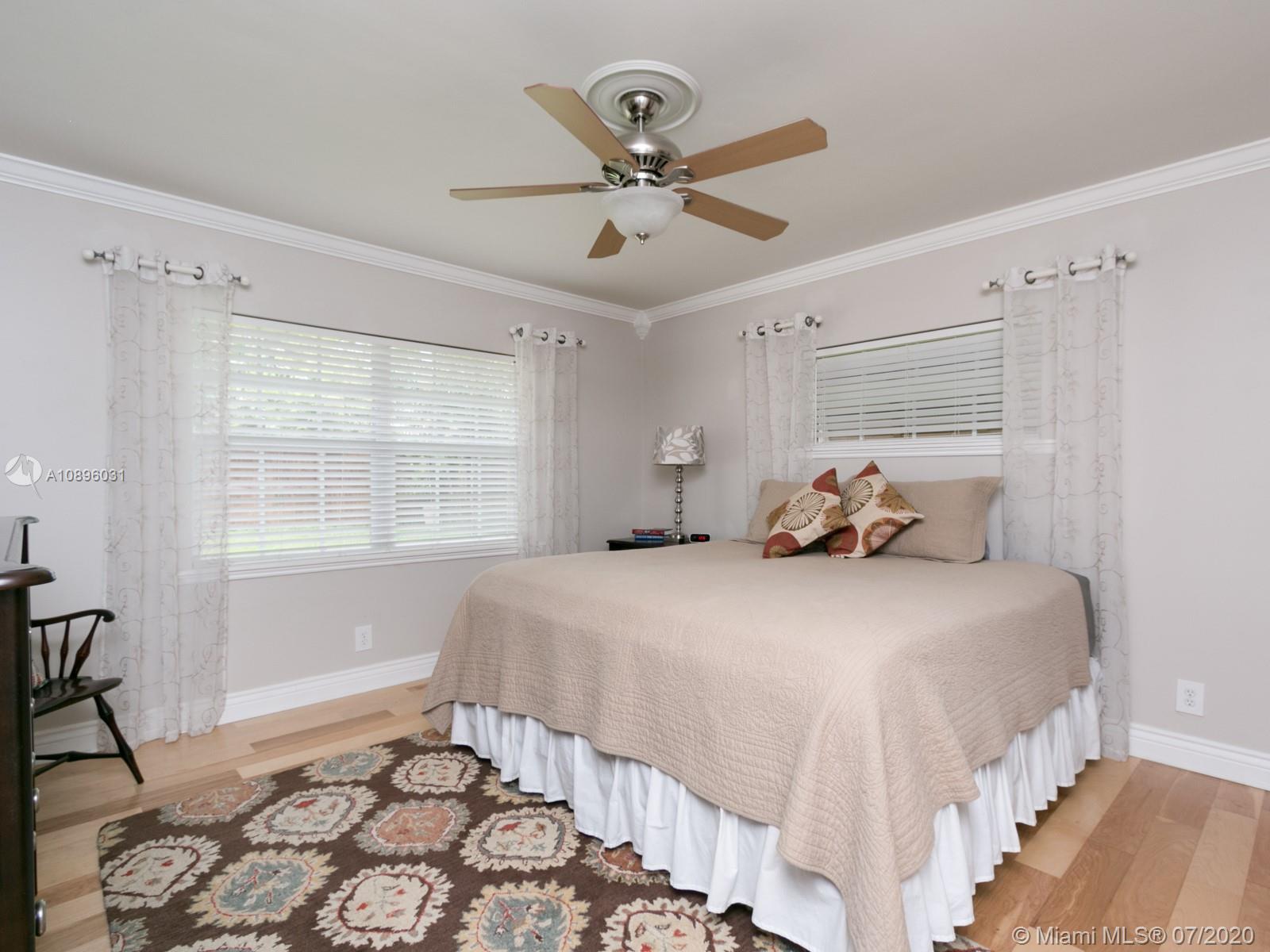 9518 Burlington Place Boca Raton, FL 33434 - Photo 21 of 35 a bedroom with a bed and window