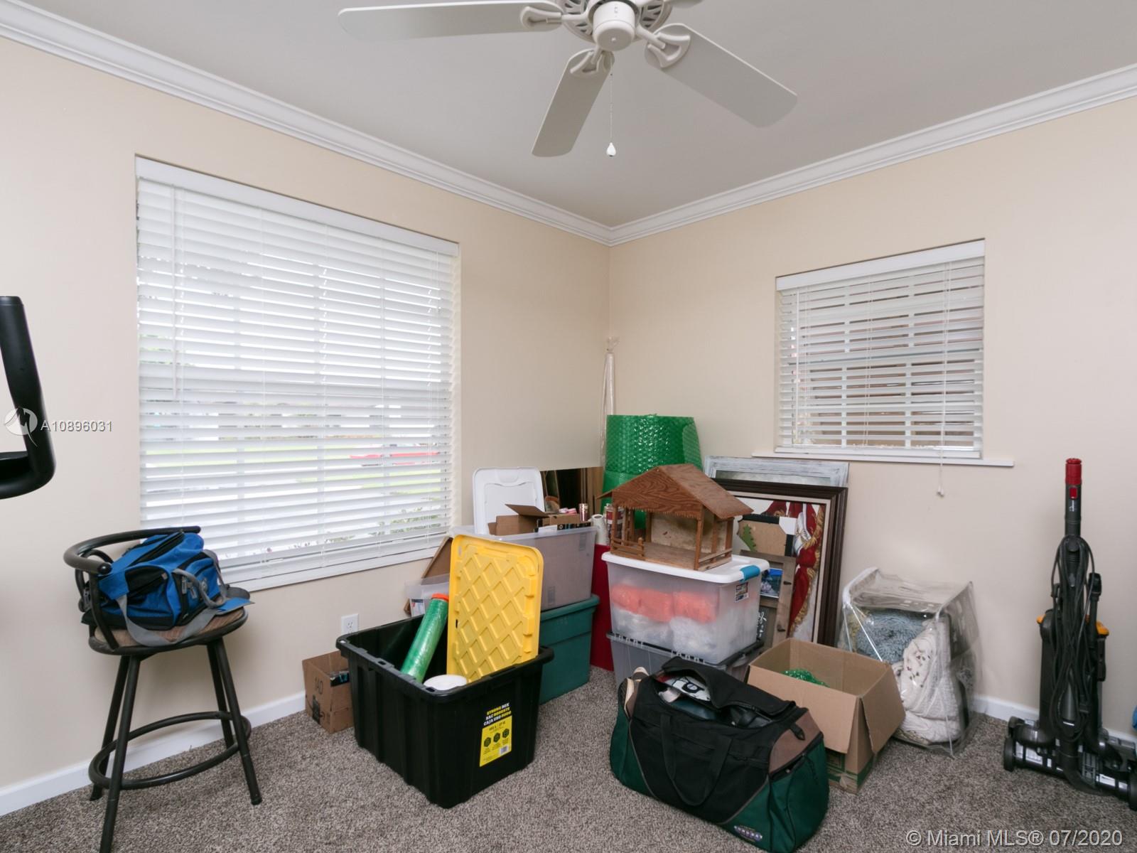 9518 Burlington Place Boca Raton, FL 33434 - Photo 27 of 35 a living room with furniture and a window