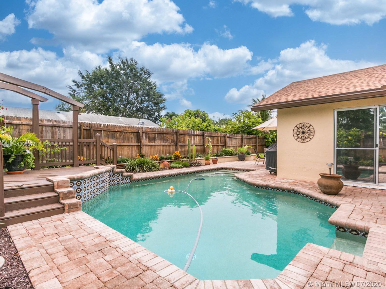 9518 Burlington Place Boca Raton, FL 33434 - Photo 29 of 35 a view of a house with swimming pool and sitting area