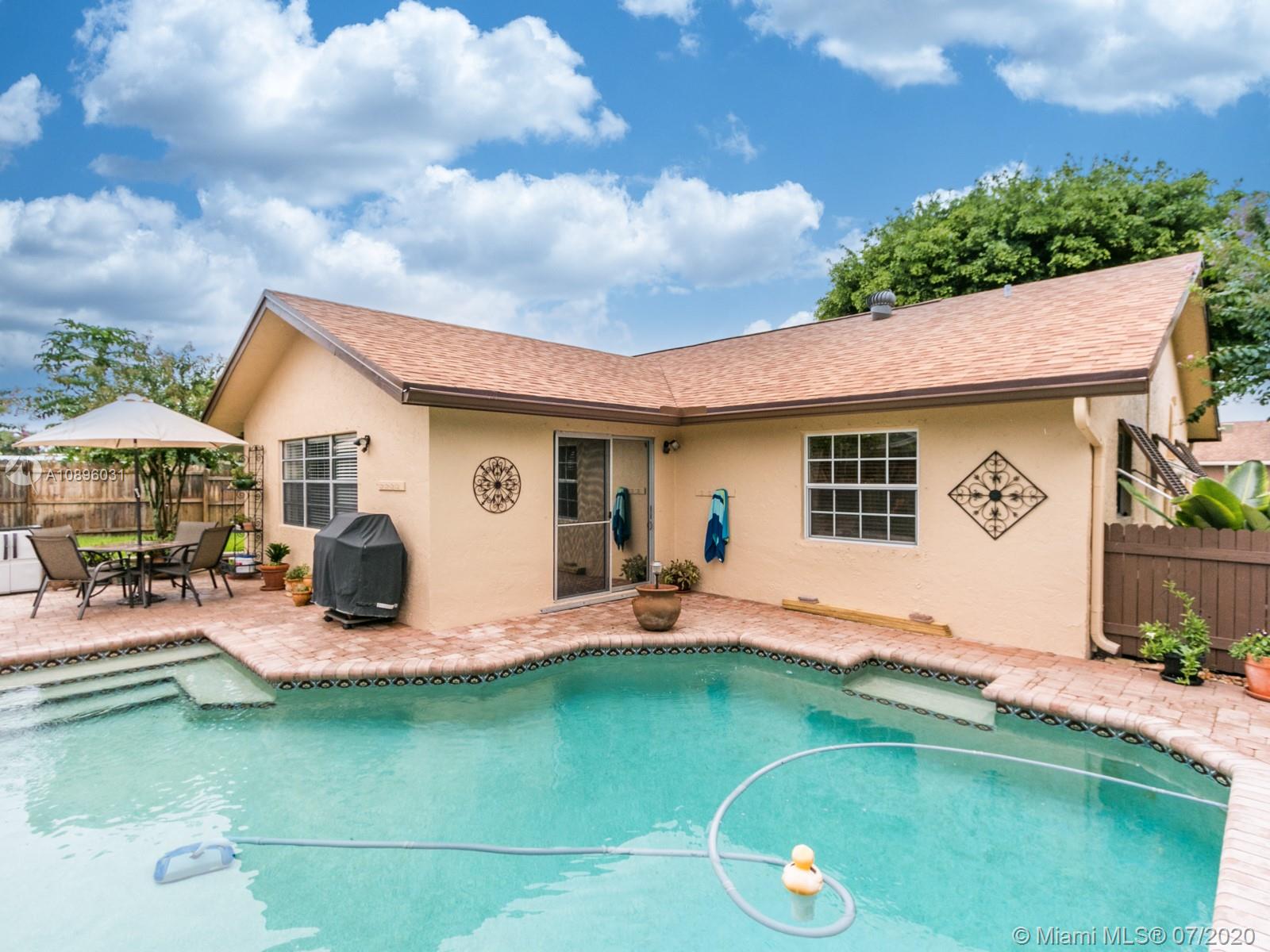 9518 Burlington Place Boca Raton, FL 33434 - Photo 30 of 35 a view of a house with backyard