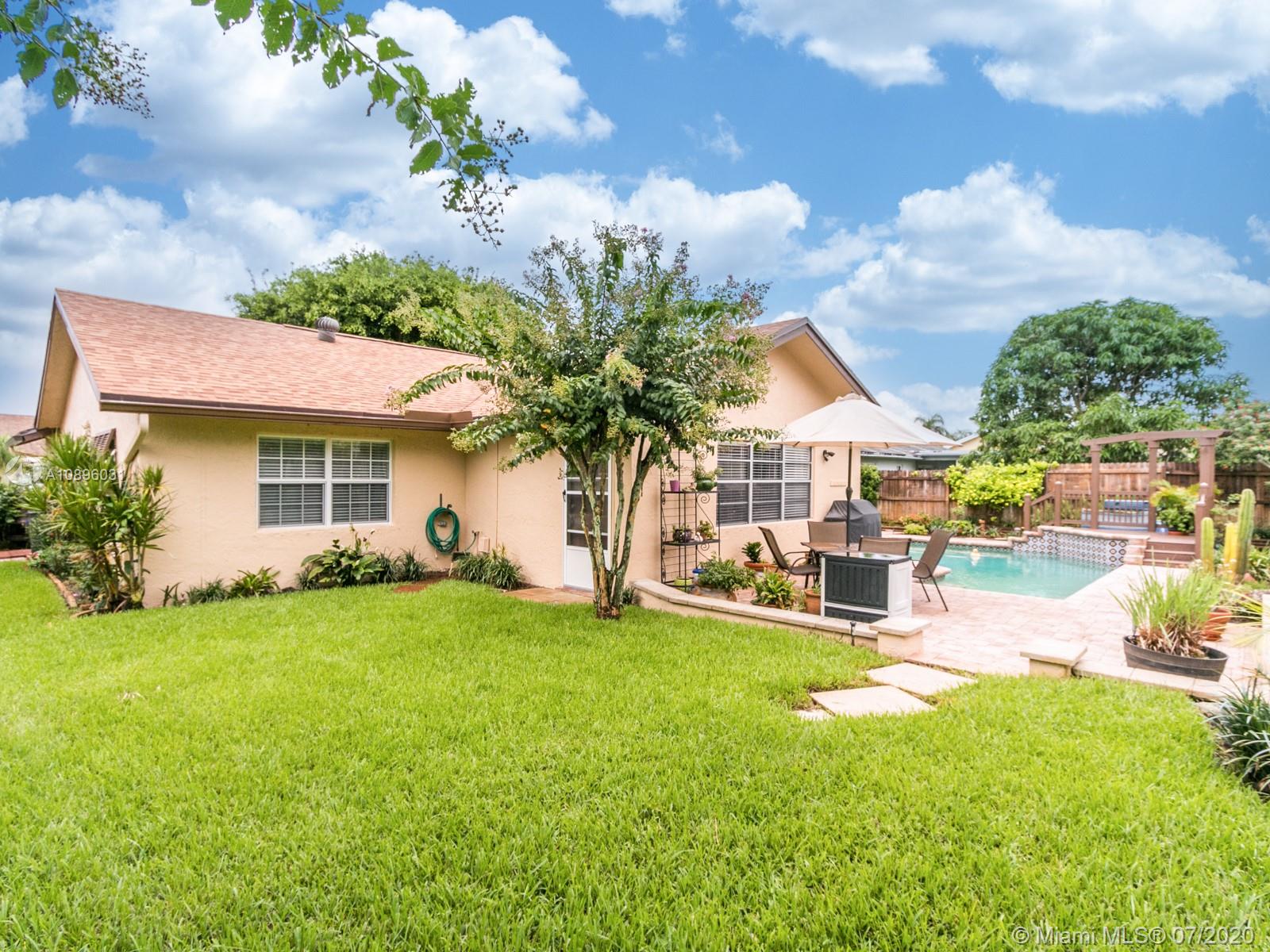 9518 Burlington Place Boca Raton, FL 33434 - Photo 33 of 35 a view of a house with backyard porch and sitting area
