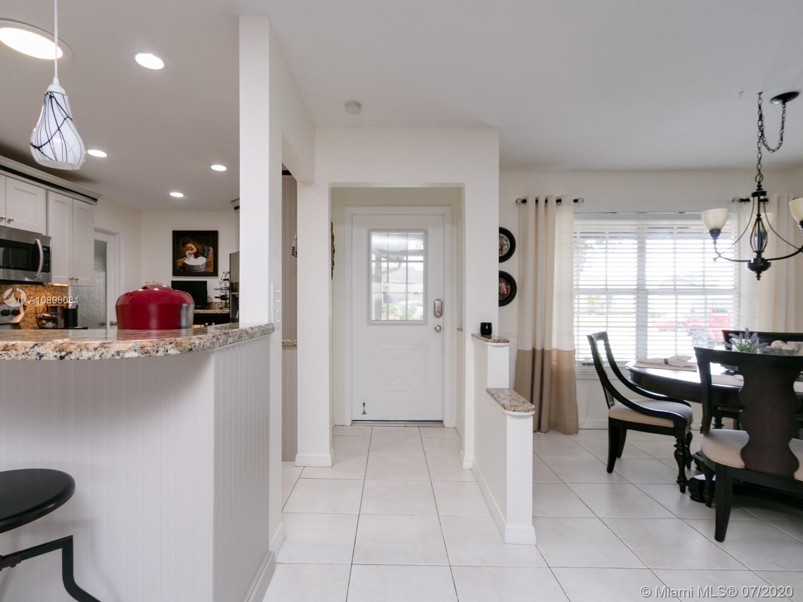 9518 Burlington Place Boca Raton, FL 33434 - Photo 5 of 35 a view of kitchen with furniture and windows