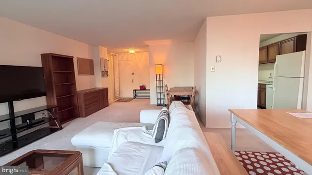 a bathroom with a sink a toilet a tub and shower