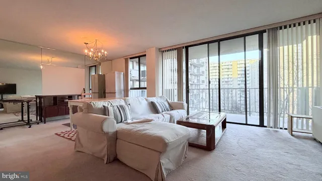 a spacious bedroom with a large bed and a large window