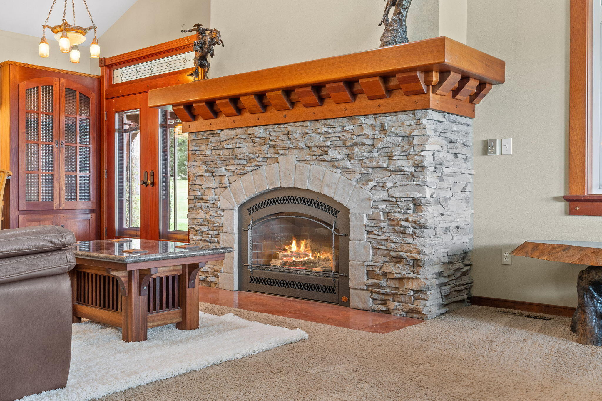 21925 Bear Creek Road Bend, OR 97702 - Photo 12 of 104 Rockwork and detailed craftsmanship on the gas fireplace