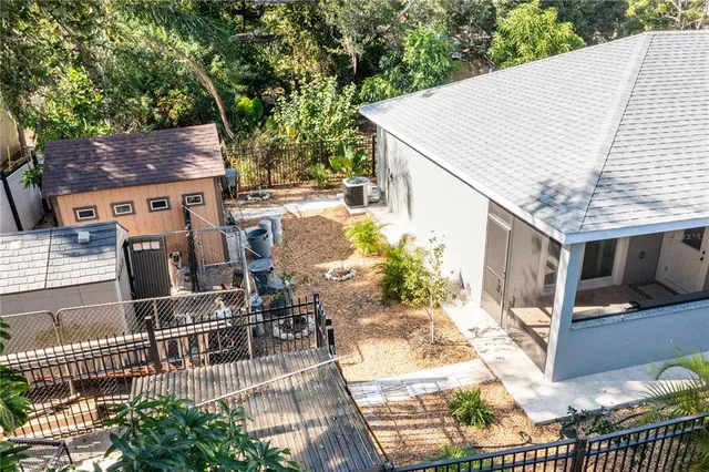 a view of a backyard with sitting area