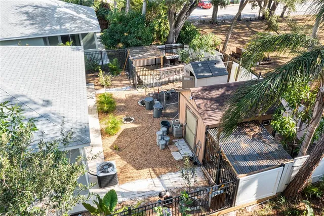 an aerial view of a house with outdoor space