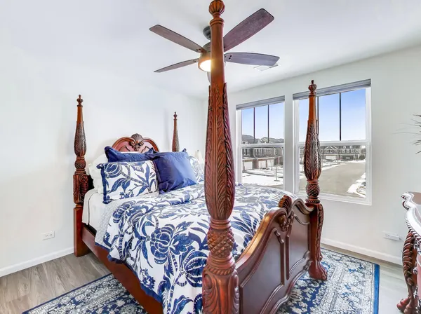 a bedroom with two beds and a chandelier