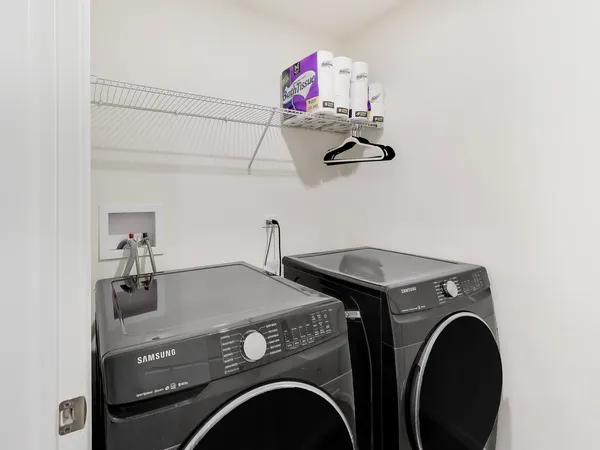 a utility room with dryer and washer