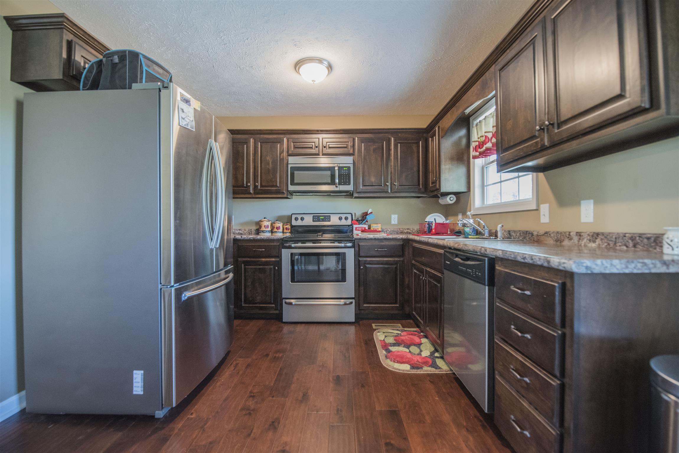 148 New Hope Road Manchester, TN 37355 - Photo 13 of 30 a kitchen with stainless steel appliances granite countertop a stove refrigerator and sink