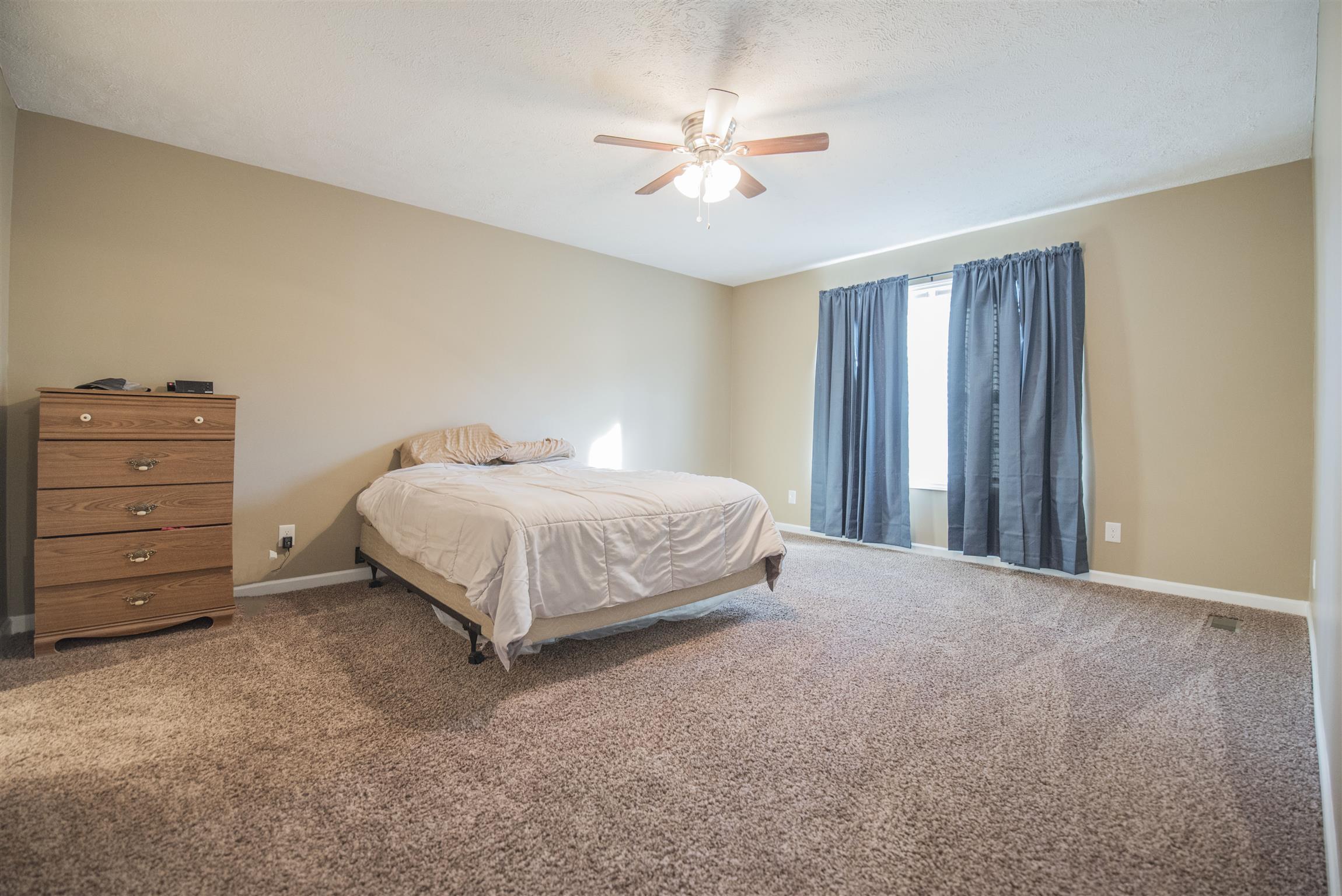 148 New Hope Road Manchester, TN 37355 - Photo 17 of 30 a bedroom with a bed and a ceiling fan