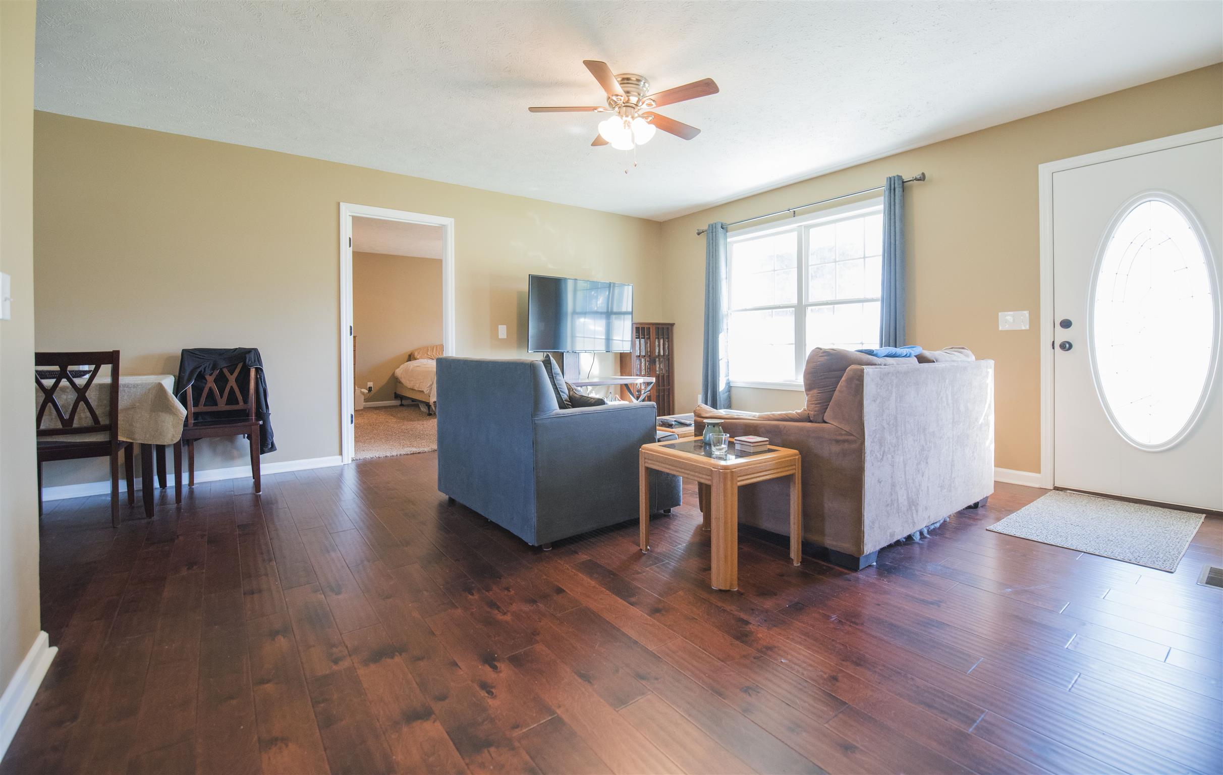 148 New Hope Road Manchester, TN 37355 - Photo 8 of 30 a living room with furniture a dining table and wooden floor