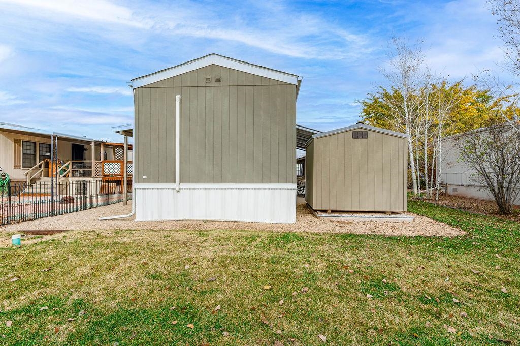 3251 E Road, Unit 106 Clifton, CO 81520 - Photo 14 of 16 a front view of a house with a yard