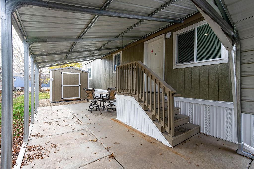 3251 E Road, Unit 106 Clifton, CO 81520 - Photo 3 of 16 a view of a porch with wooden floor and outdoor seating