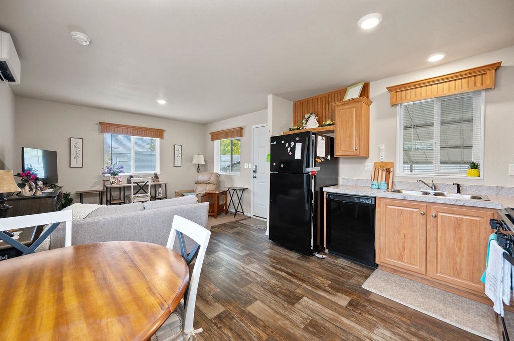 3251 E Road, Unit 106 Clifton, CO 81520 - Photo 8 of 16 a large living room with stainless steel appliances granite countertop a couch and a large window