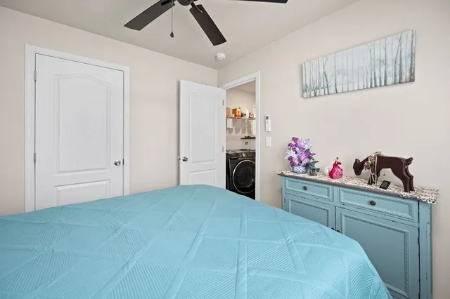 a bedroom with a bed and cabinets
