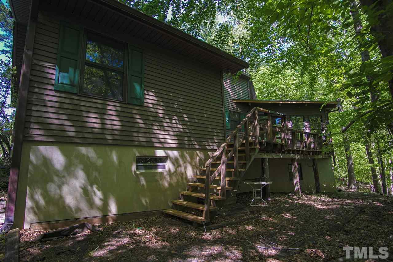 371 Lassiter Road Pittsboro, NC 27312 - Photo 5 of 19 a house view with a backyard