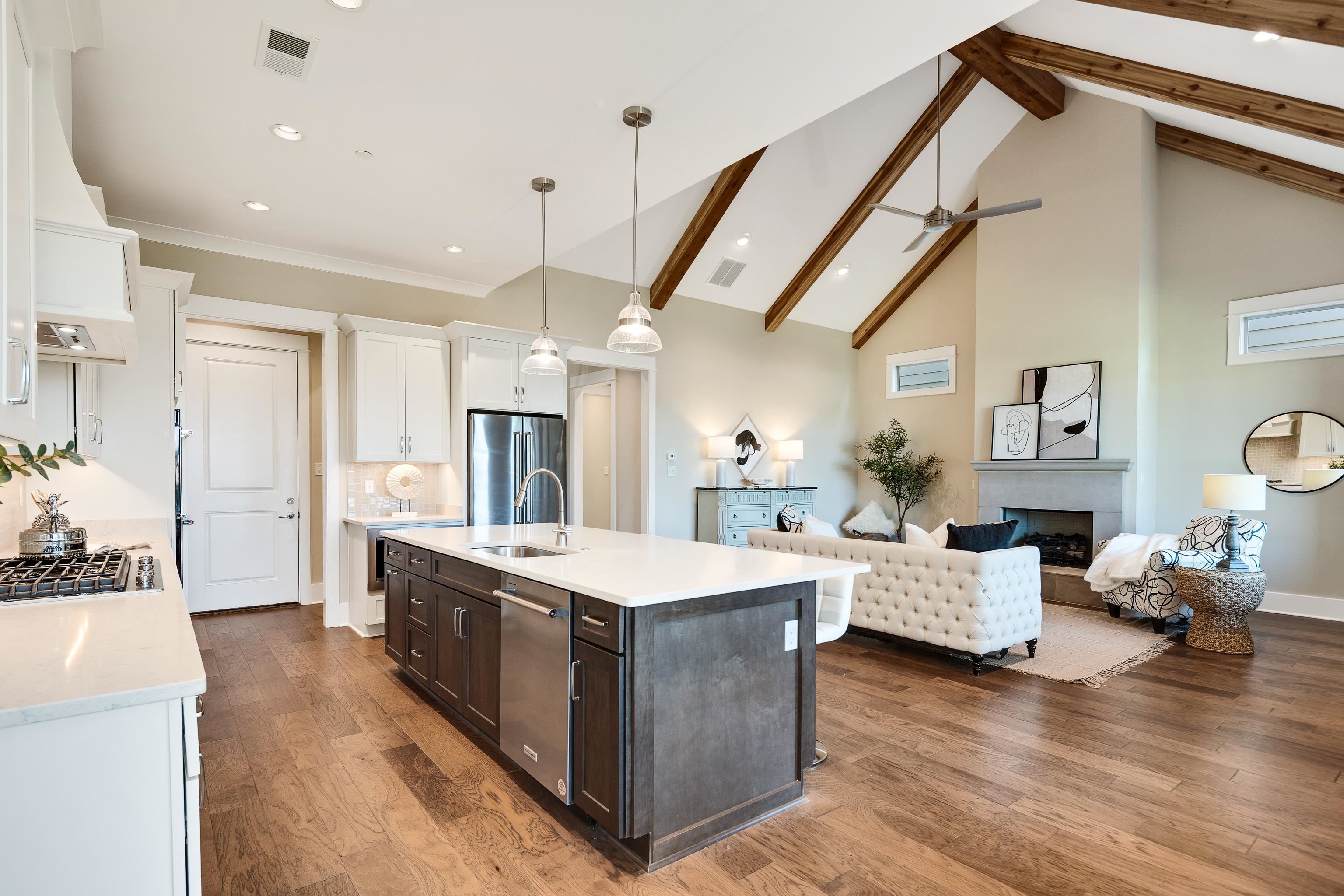 10136 Cliveden Circle North Collierville, TN 38017 - Photo 14 of 39 Kitchen featuring stainless steel appliances, light countertops, dark brown cabinetry, custom range hood, and white cabinets