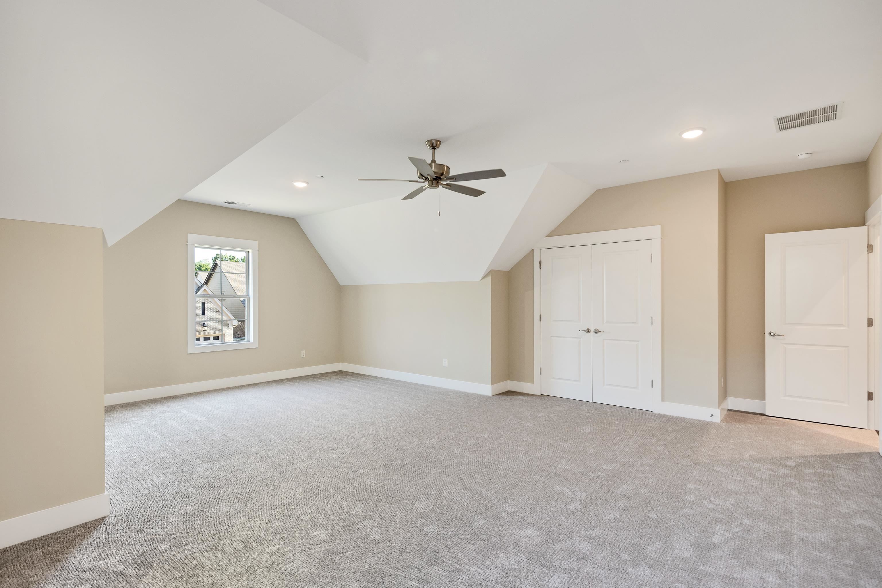 10136 Cliveden Circle North Collierville, TN 38017 - Photo 28 of 39 Additional living space featuring carpet flooring, lofted ceiling, ceiling fan, and recessed lighting