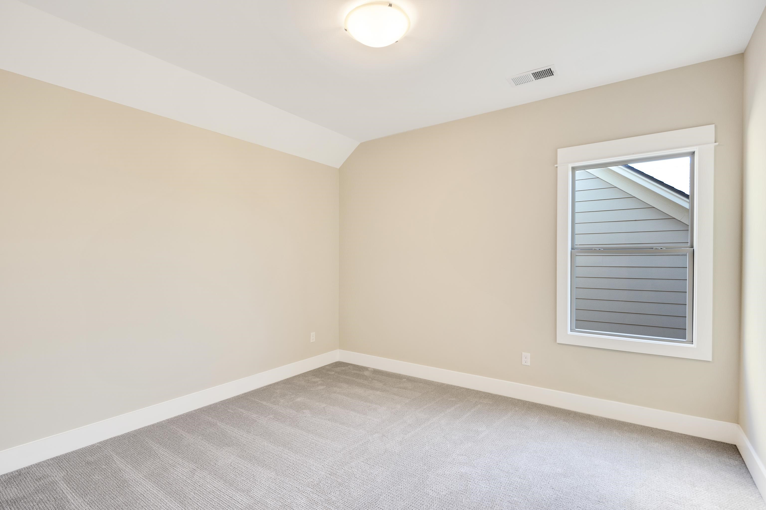 10136 Cliveden Circle North Collierville, TN 38017 - Photo 30 of 39 Unfurnished room with carpet floors and vaulted ceiling
