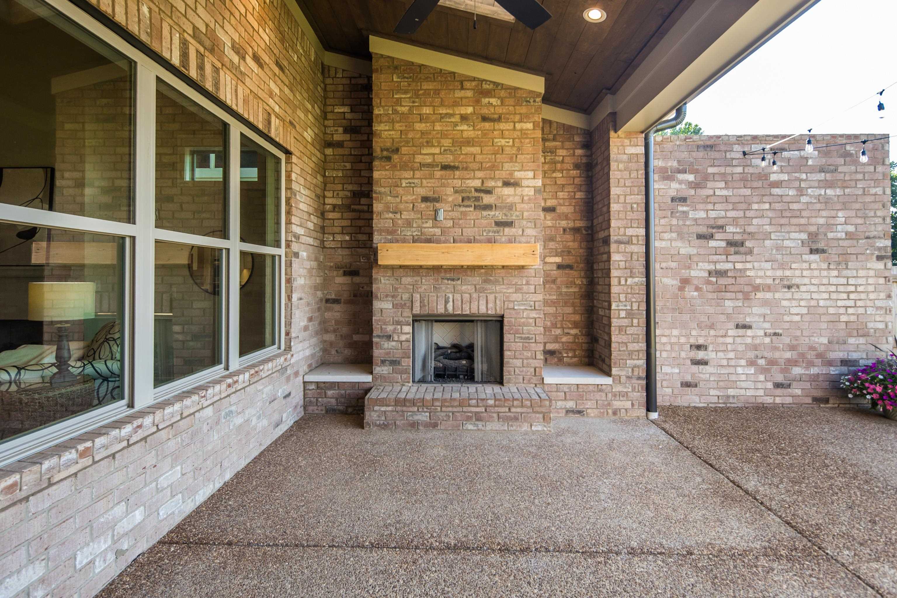 10136 Cliveden Circle North Collierville, TN 38017 - Photo 33 of 39 View of patio / terrace with an outdoor brick fireplace