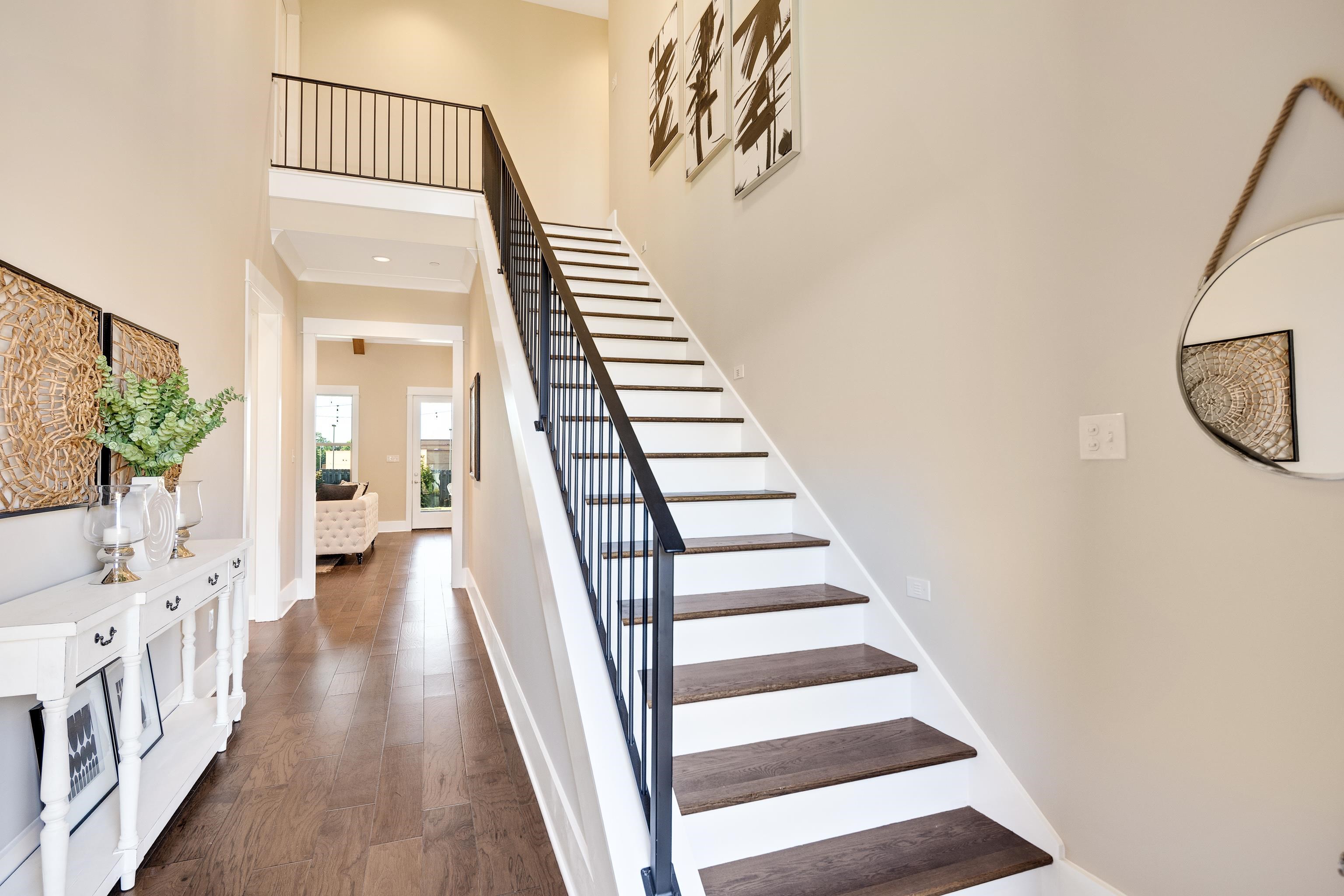 10136 Cliveden Circle North Collierville, TN 38017 - Photo 4 of 39 Staircase featuring a towering ceiling and wood finished floors