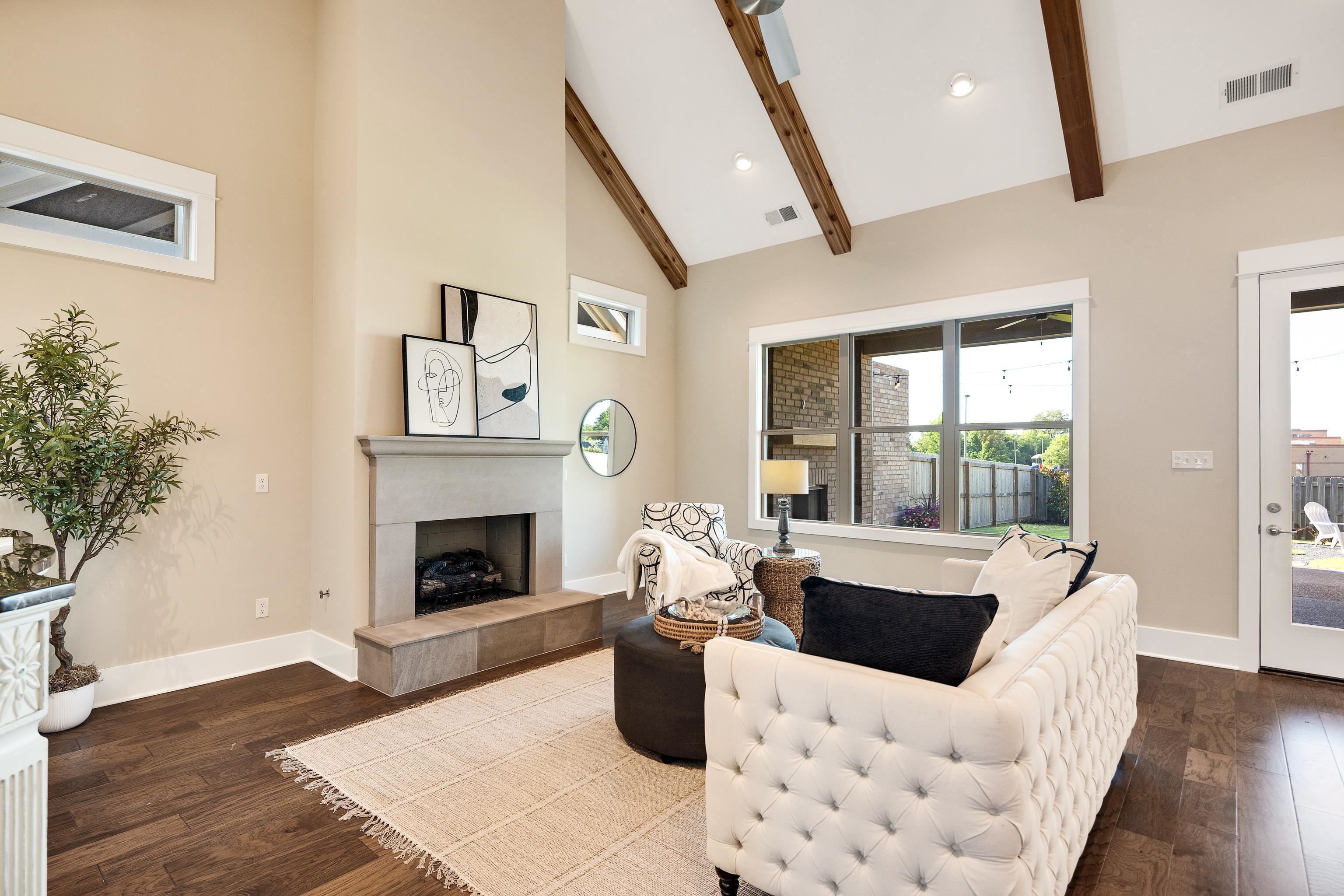 10136 Cliveden Circle North Collierville, TN 38017 - Photo 7 of 39 Living room with dark wood-style floors, a tiled fireplace, and recessed lighting