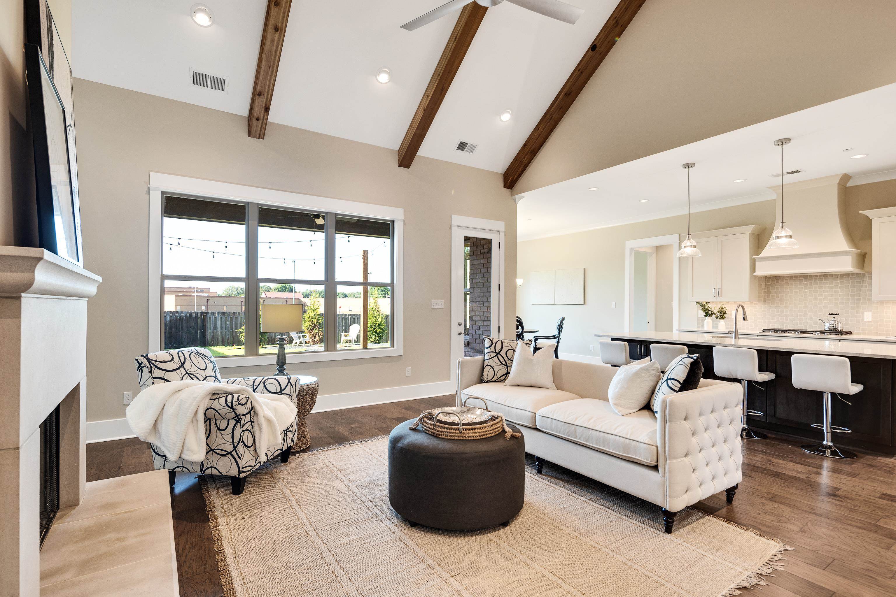 10136 Cliveden Circle North Collierville, TN 38017 - Photo 8 of 39 Living room with wood finished floors, a fireplace, beamed ceiling, recessed lighting, and a ceiling fan