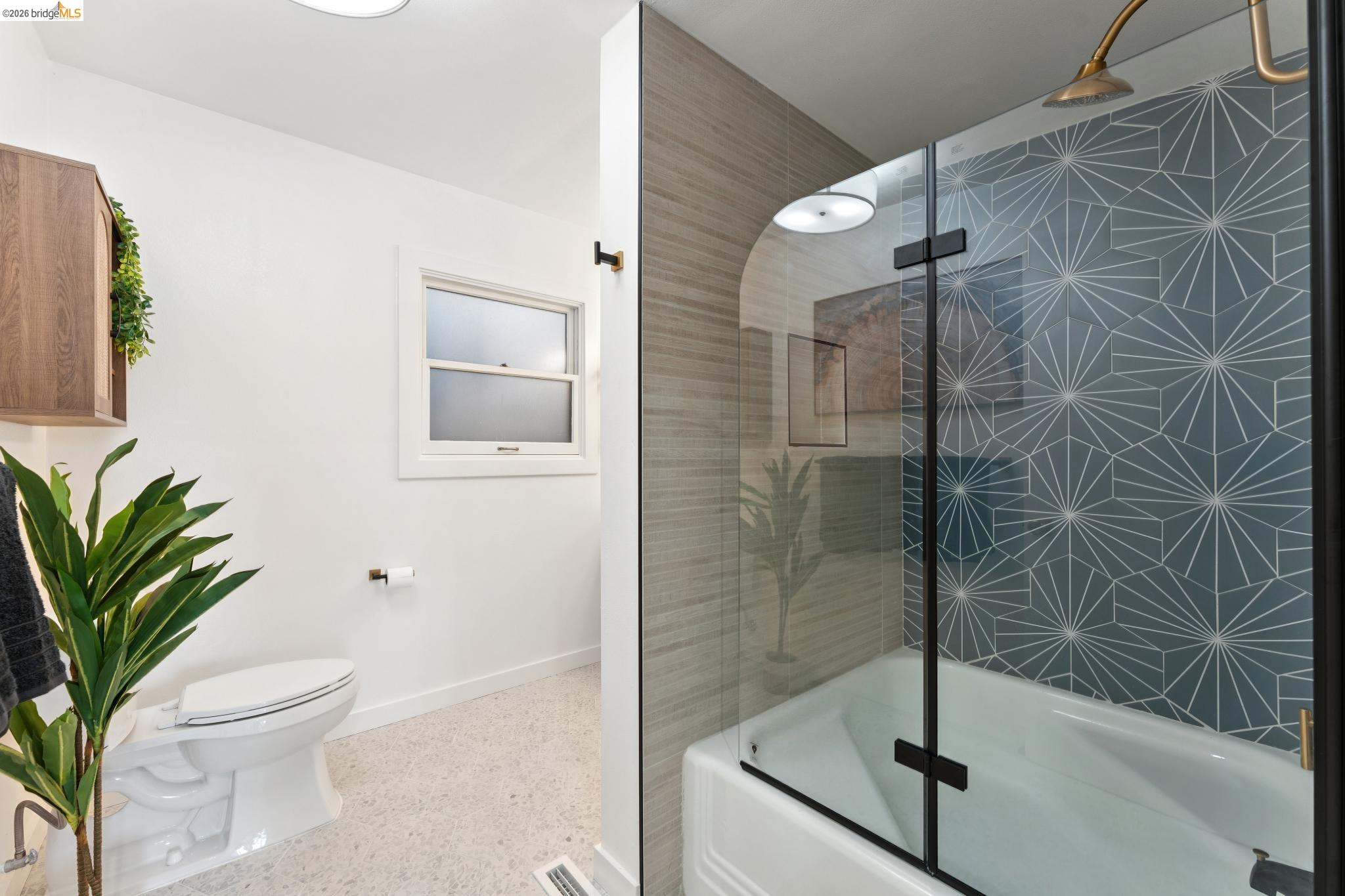 2301 Oak Street Berkeley, CA 94708 - Photo 22 of 61 Bathtub with glass shower screen and patterned tile surround