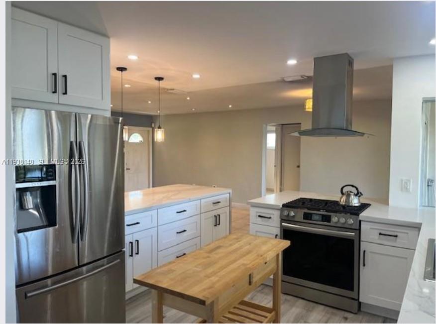 7281 Sunset Strip Sunrise, FL 33313 - Photo 12 of 25 a kitchen with a stove and a refrigerator