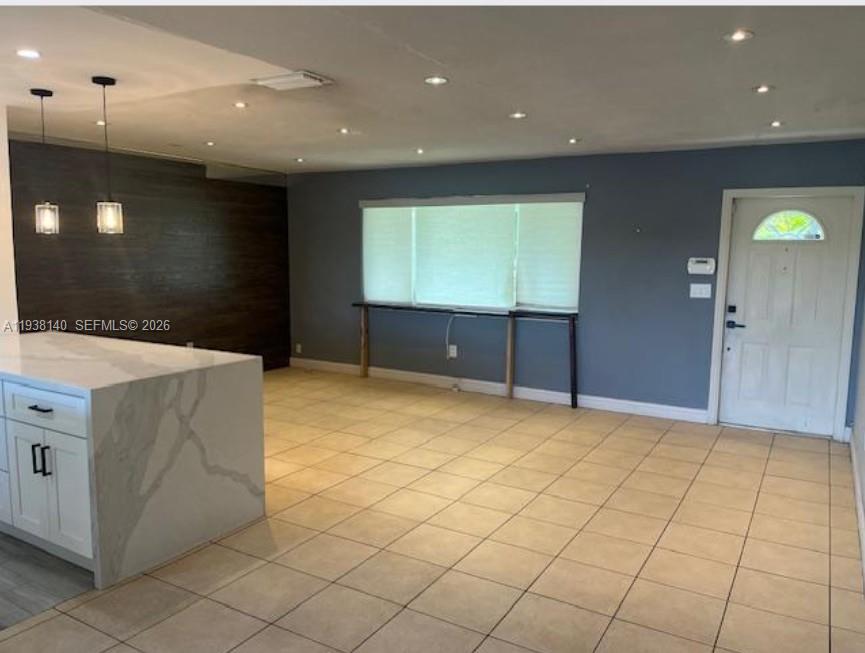 7281 Sunset Strip Sunrise, FL 33313 - Photo 3 of 25 a view of an empty room with a window