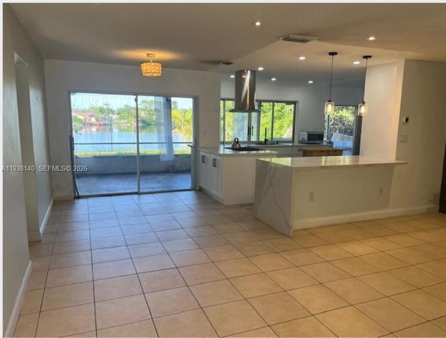 7281 Sunset Strip Sunrise, FL 33313 - Photo 5 of 25 an empty room with kitchen view