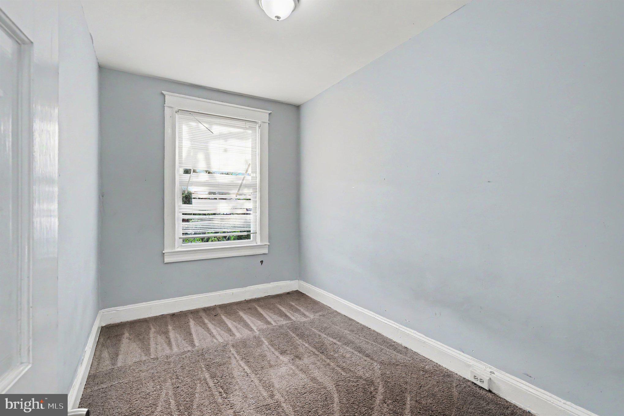 409 Edgewood Street Baltimore, MD 21229 - Photo 18 of 30 an empty room with a window