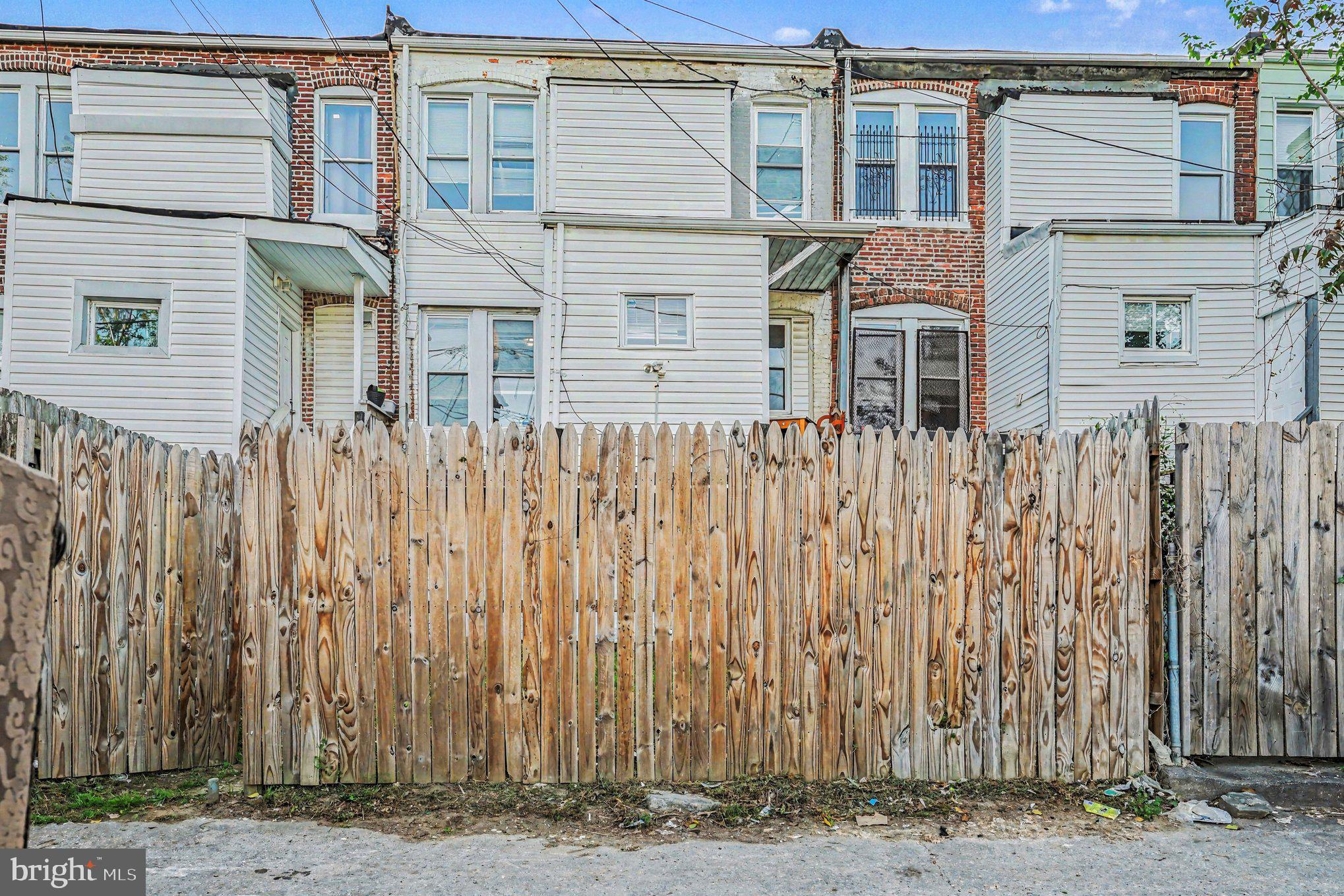 409 Edgewood Street Baltimore, MD 21229 - Photo 26 of 30 a front view of a house with a garden