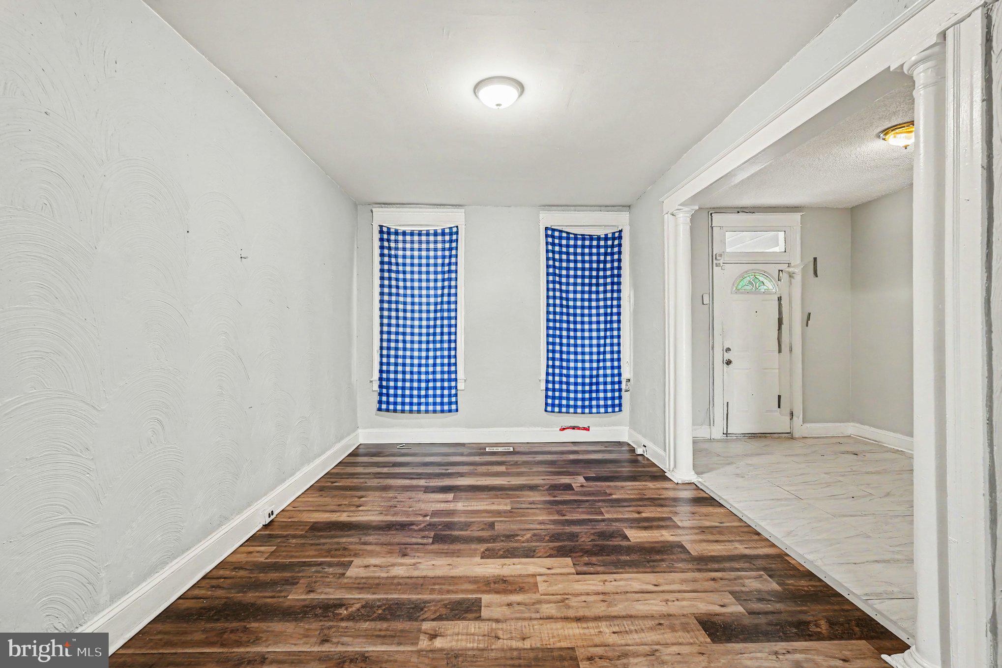 409 Edgewood Street Baltimore, MD 21229 - Photo 8 of 30 a view of an empty room with a window