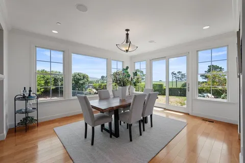 a living room with furniture and a rug