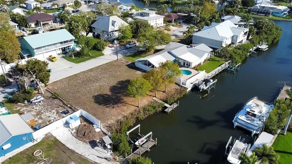 an aerial view of a house with a lake view
