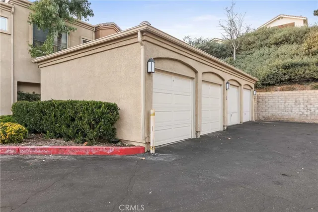 a front view of a house with garage
