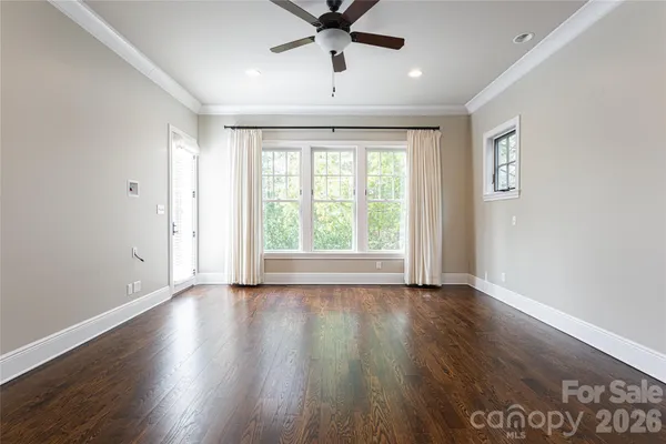 a bathroom with a granite countertop sink a mirror and a shower