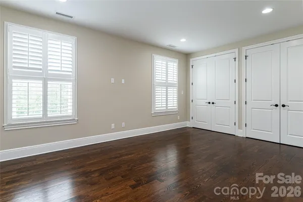 a view of porch with a floor to ceiling window and wooden floor