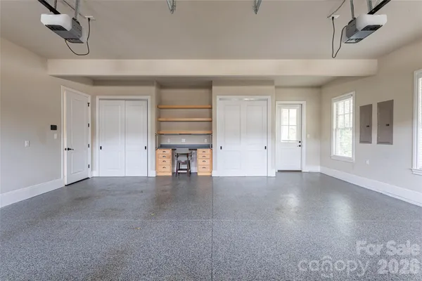 a view of balcony with wooden floor and fence