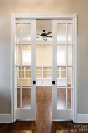 a view of a livingroom with a furniture and floor to ceiling window