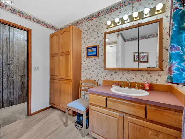 a bathroom with a sink a mirror and a bathtub